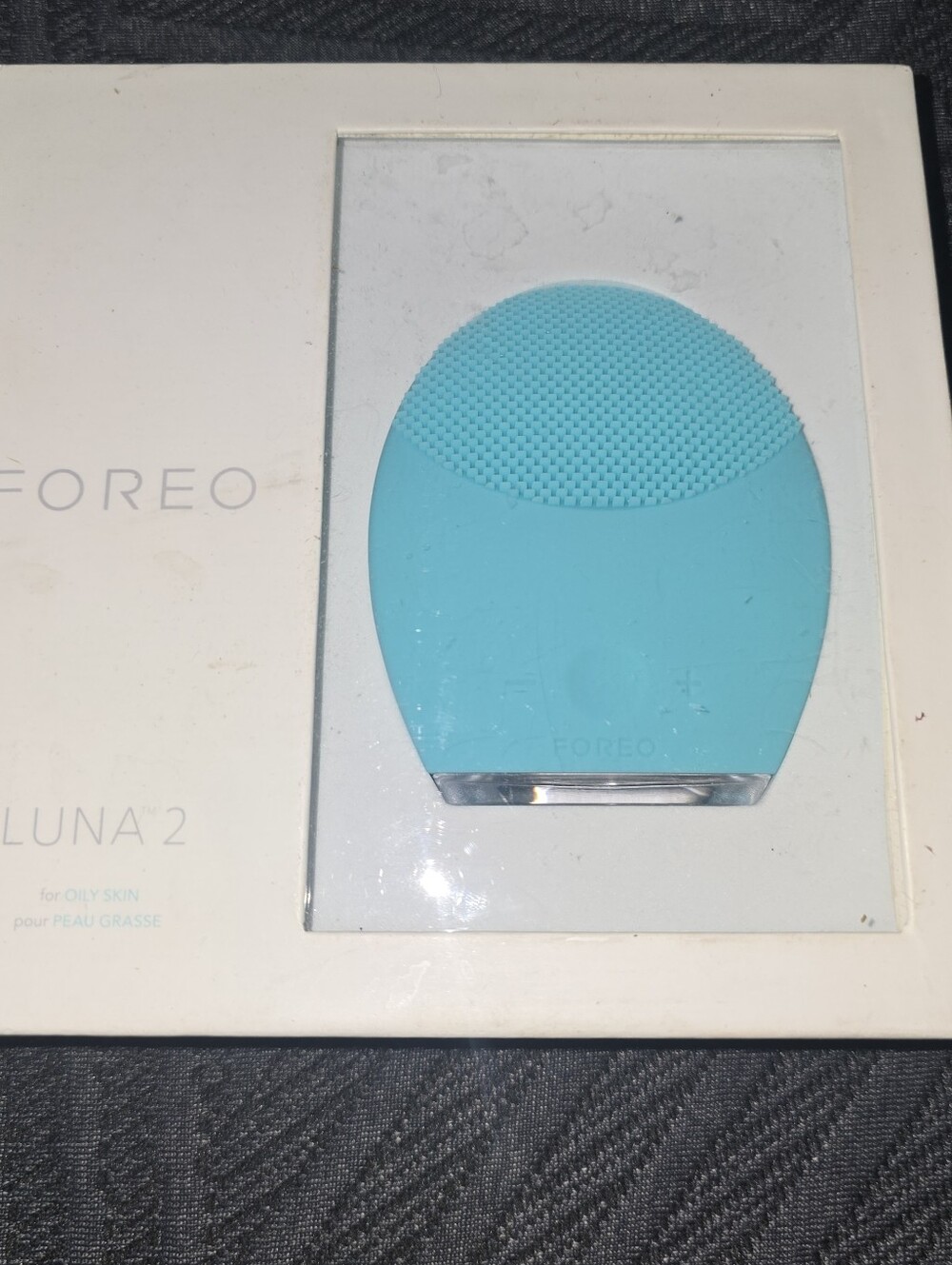 FOREO turquoise silicone facial cleansing device